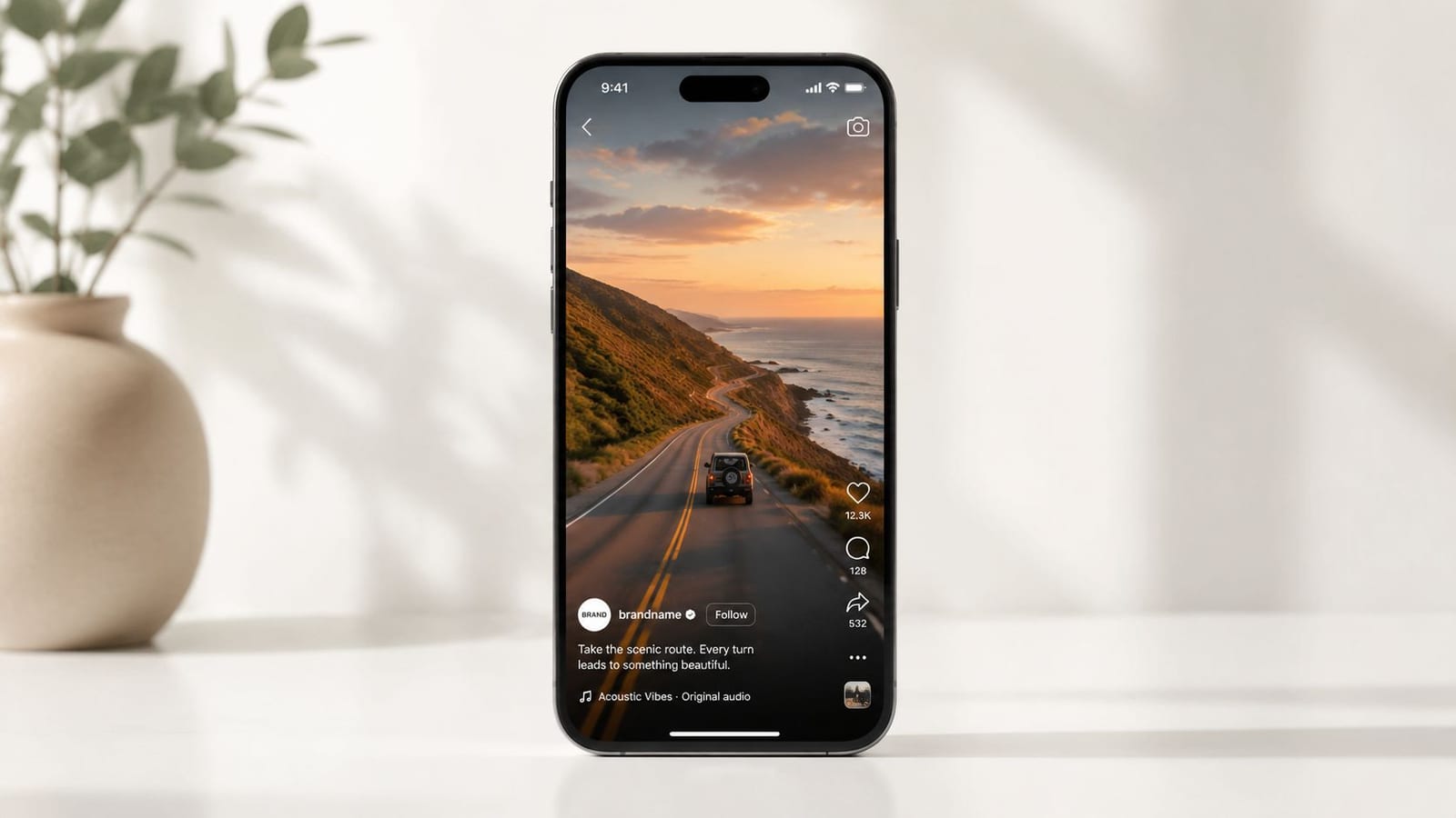 A smartphone screen displaying a scenic coastal road trip video on a social media app feed.